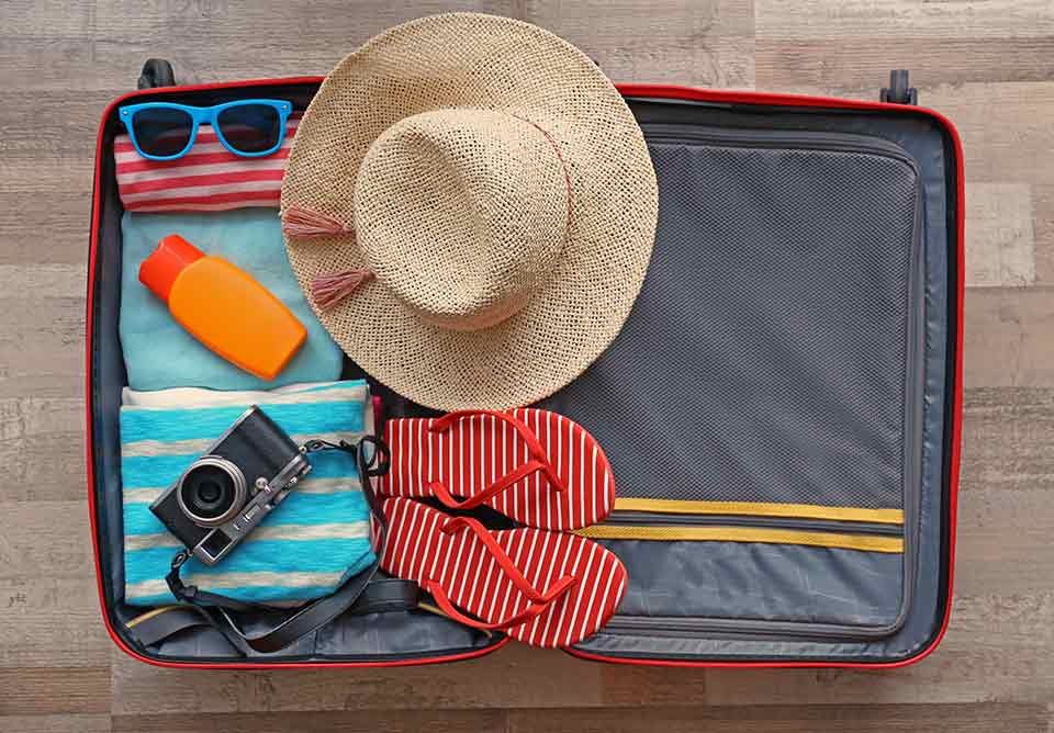 a suitcase packed with travel essentials