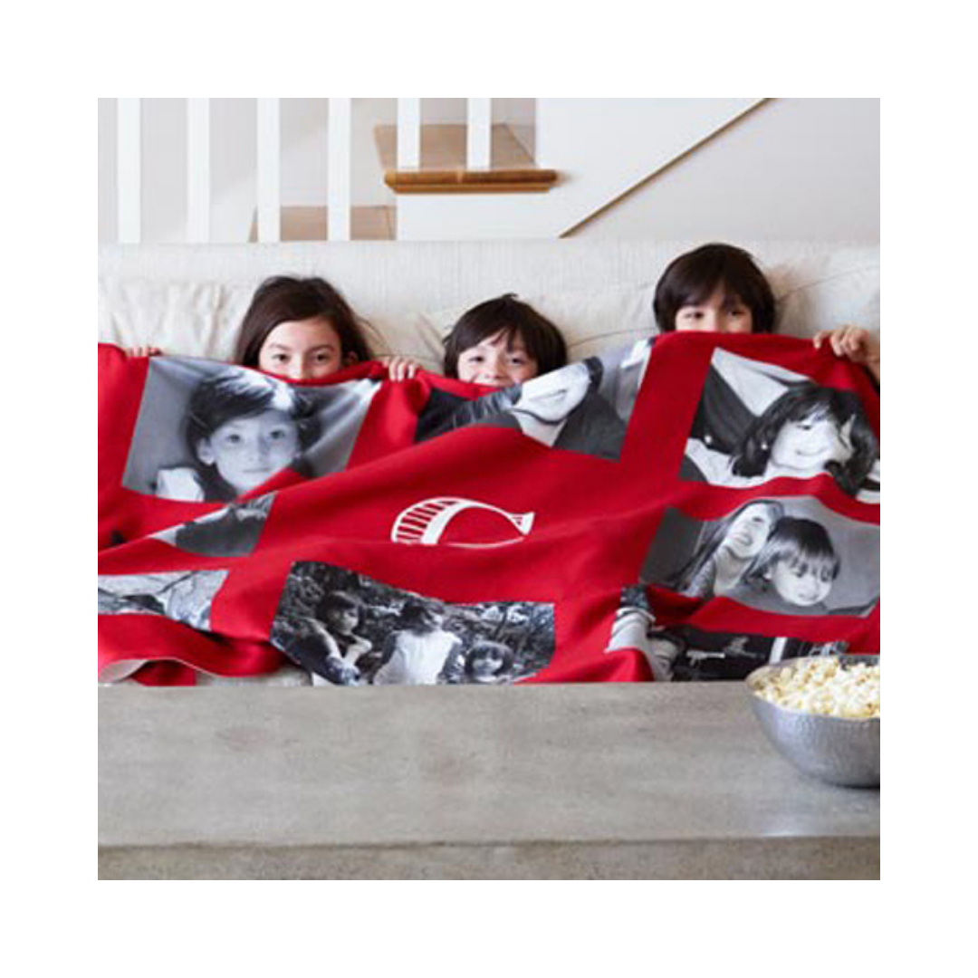 kids snuggled under personalized blanket with their pictures