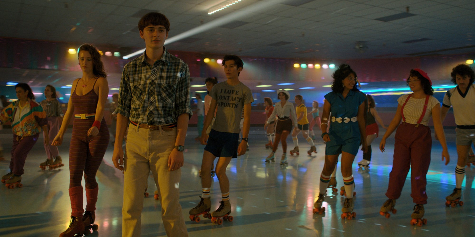 A skating rink full of people.